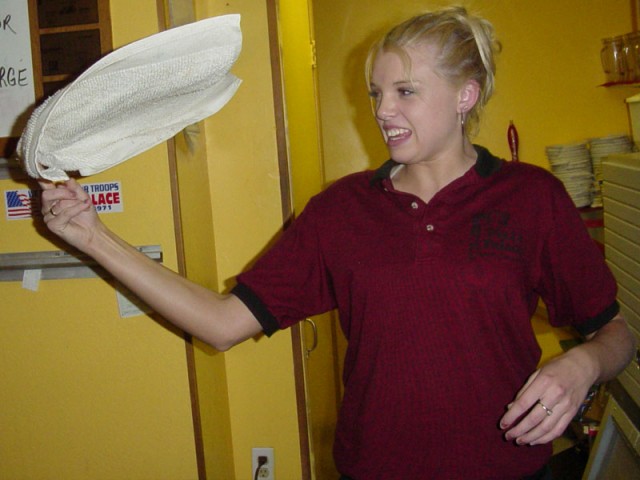Kiersten trying to spin a towel at Pizza Palace