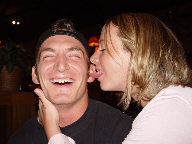 Turbo getting his ear licked by a waitress at Rock Bottom