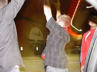 Aaron celebrating to a girl's boyfriend after getting a kiss on the cheek from her