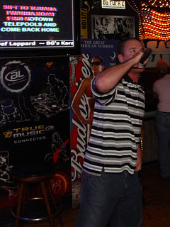 Some dude doing Kid Rock karaoke