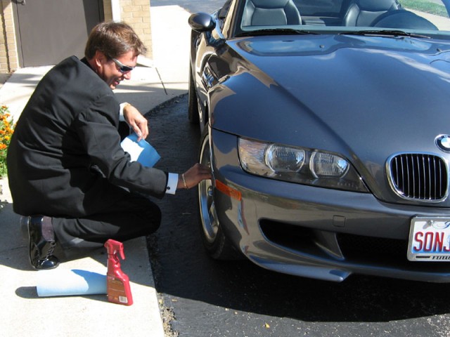 Rick wiping down the wheels of his BMW M Coupe