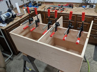 I ripped down some 3/8" x 3/4" strips of solid oak to face the inner shelves.