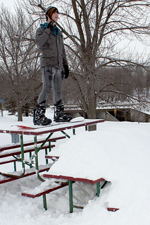 Snowboarding - Gabe on our homemade picnic table drop-in