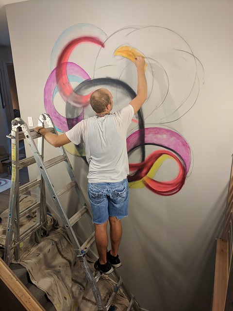 Vance switched off between acrylics, charcoal, markers, and spray cans.