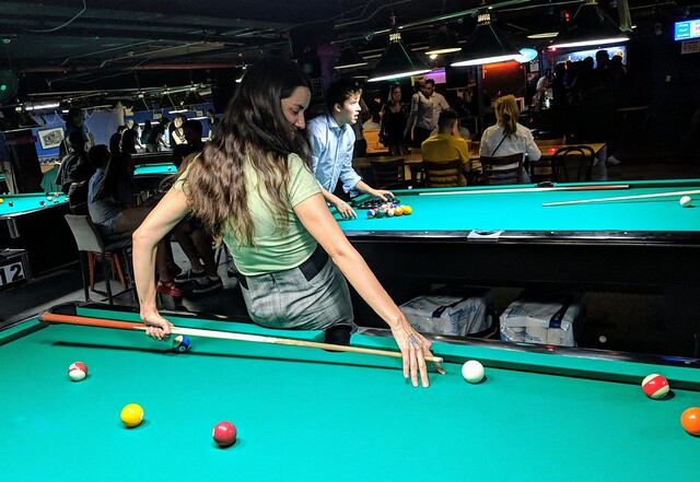 Ayla shows us how to shoot pool