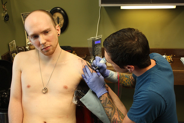 Getting tattooed by Joshua Bowers at Iron Heart Tattoo