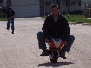 Chuck McGrane - Aaron trying to catch chuck on a scooter