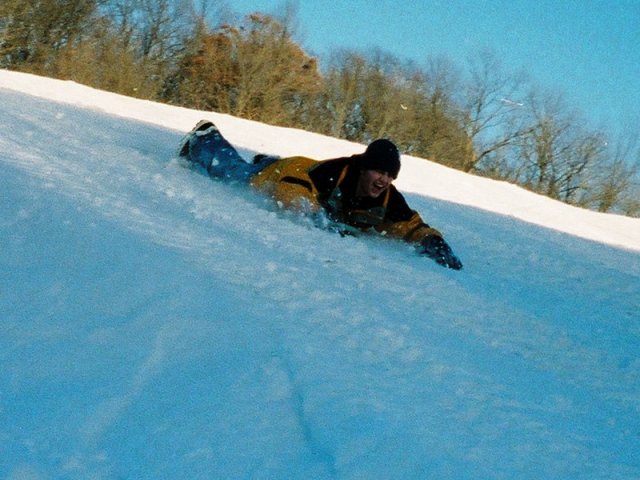 Laying on the snowboard