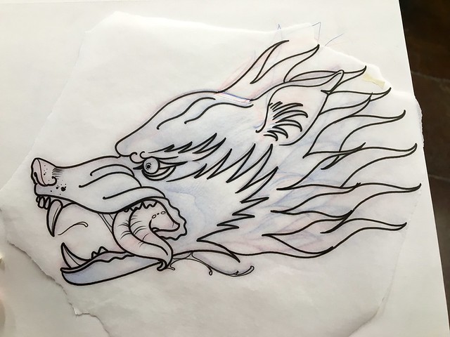 Joshua's outline of my wolf head tattoo