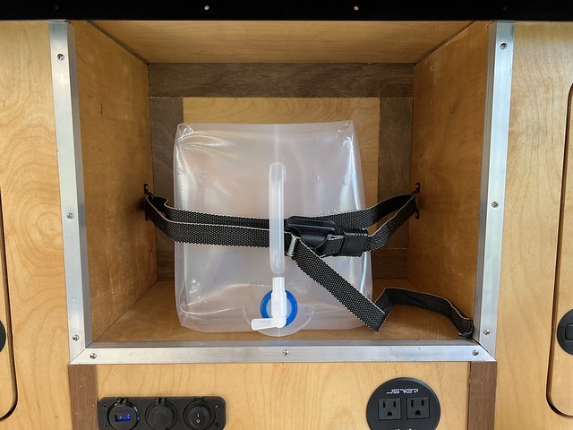 Added some footman's loops to the galley cubby in my camper so that we could strap some water in ...