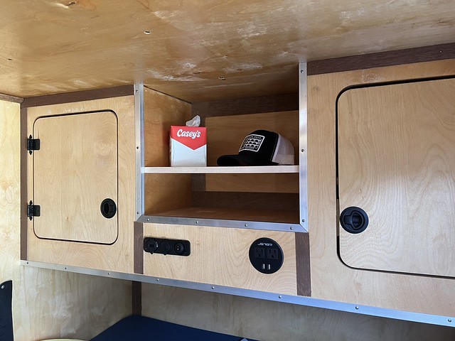 New shelf to get a little more surface area in the camper. Electronics and pocket stuff on bottom...
