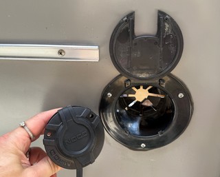 The Noco shore power plug is much better than the passthrough... and is almost exactly the right size to fit inside.