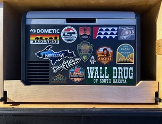 Travel - Been grabbing some stickers from various trips recently and decided to sticker bomb the Dometic 