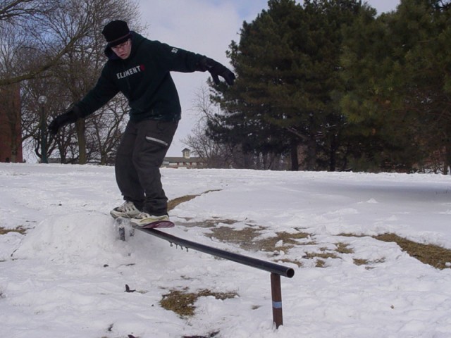 Zach snowskating behind pfeiffer