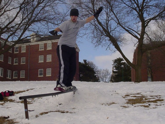 Grinding the rail with my snowskate