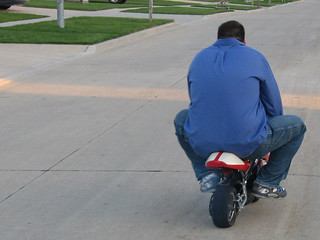 Kevi's lost enough weight to ride the pocket bike, weeee!